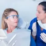 dentist explains to patient